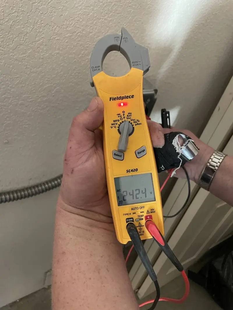 Voltage testing with clamp meter during Generator Installation in Honeygo